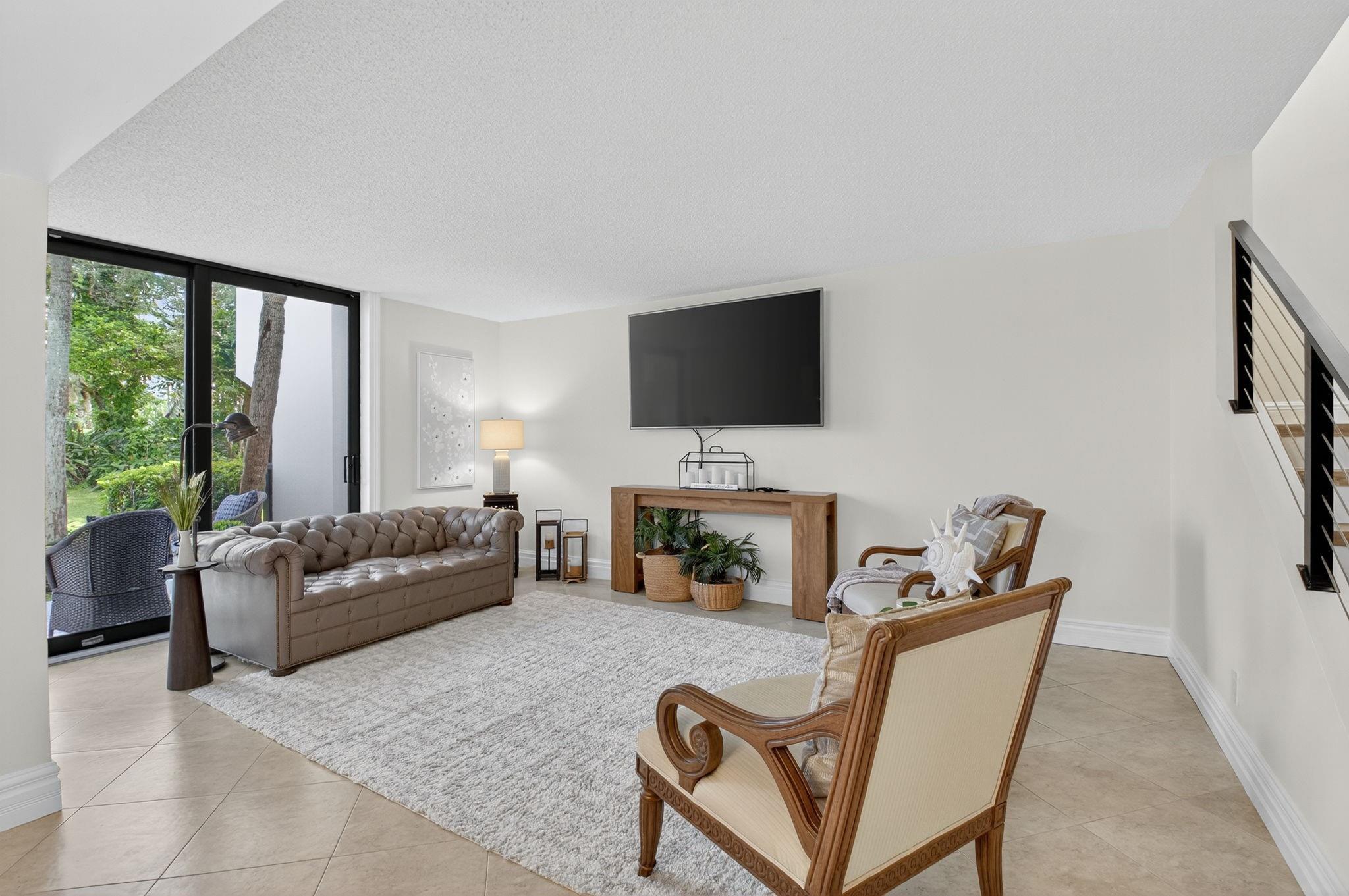 3802 Bridgewood Drive Boca Raton, FL 33434 - Photo 13 of 46 a living room with furniture and a flat screen tv