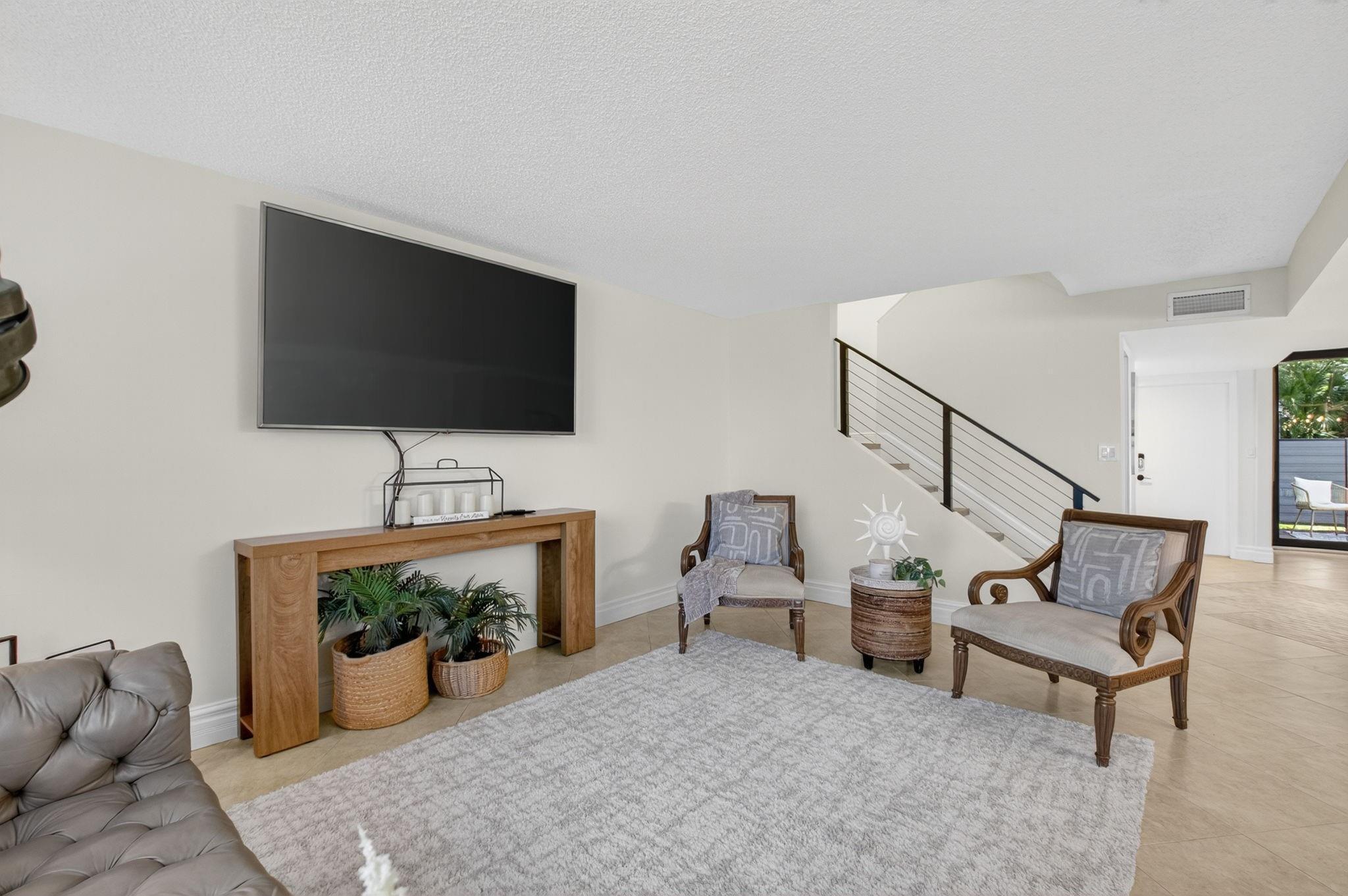 3802 Bridgewood Drive Boca Raton, FL 33434 - Photo 14 of 46 a living room with furniture and a flat screen tv
