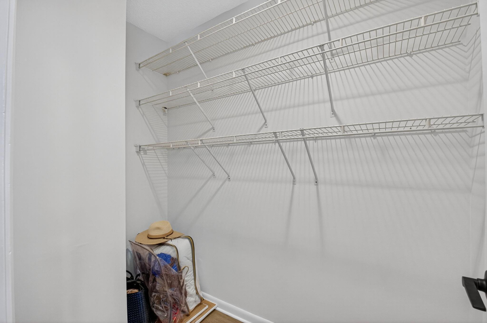 3802 Bridgewood Drive Boca Raton, FL 33434 - Photo 19 of 46 a view of storage and utility room with racks on the wall