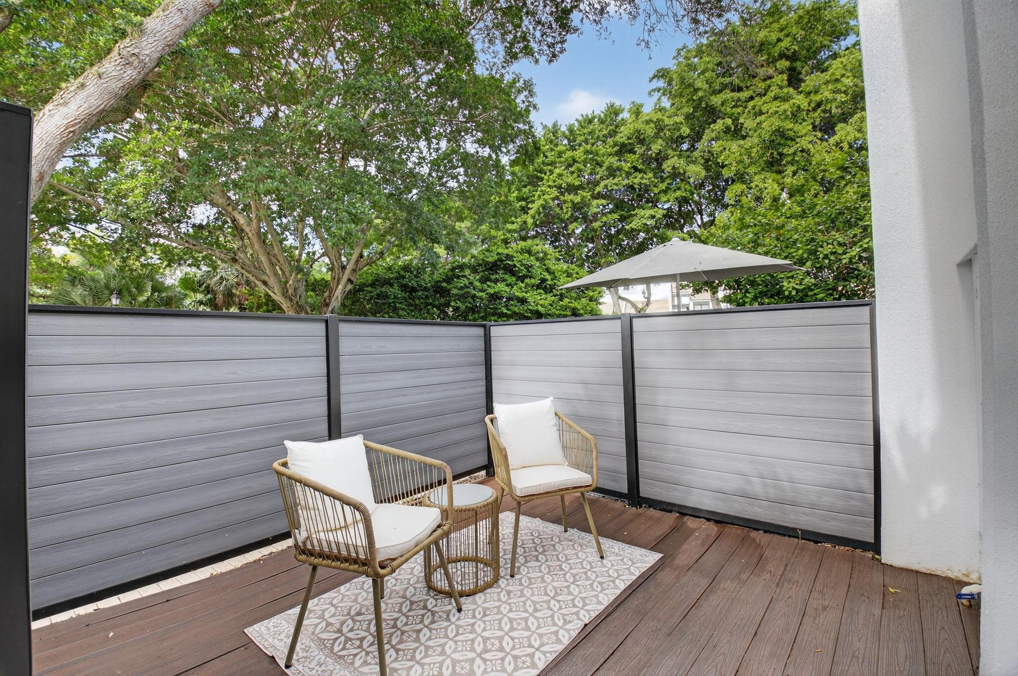3802 Bridgewood Drive Boca Raton, FL 33434 - Photo 6 of 46 a wooden bench sitting in backside of a house