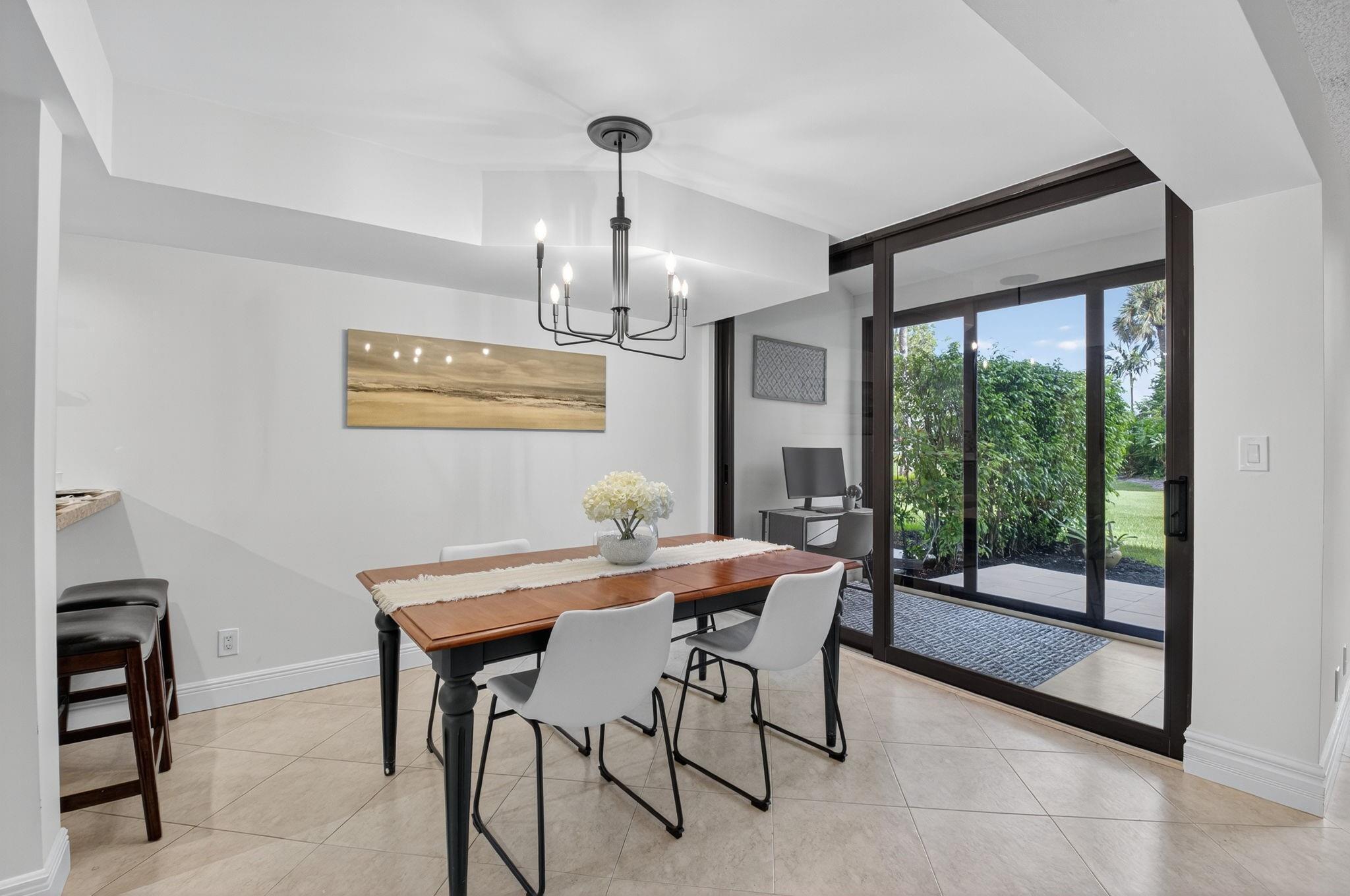 3802 Bridgewood Drive Boca Raton, FL 33434 - Photo 10 of 46 a view of a dining room with furniture window and outside view