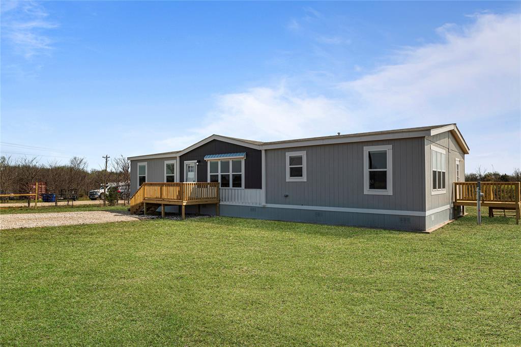 3888 Sandusky Road Whitesboro, TX 76273 - Photo 3 of 24 Homs, deck, and a lawn
