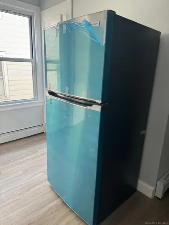 a kitchen with a sink cabinets and stainless steel appliances
