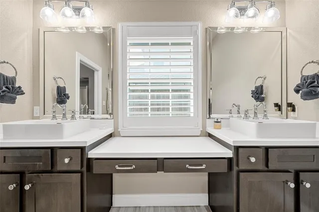 a sink with a sink and chandelier