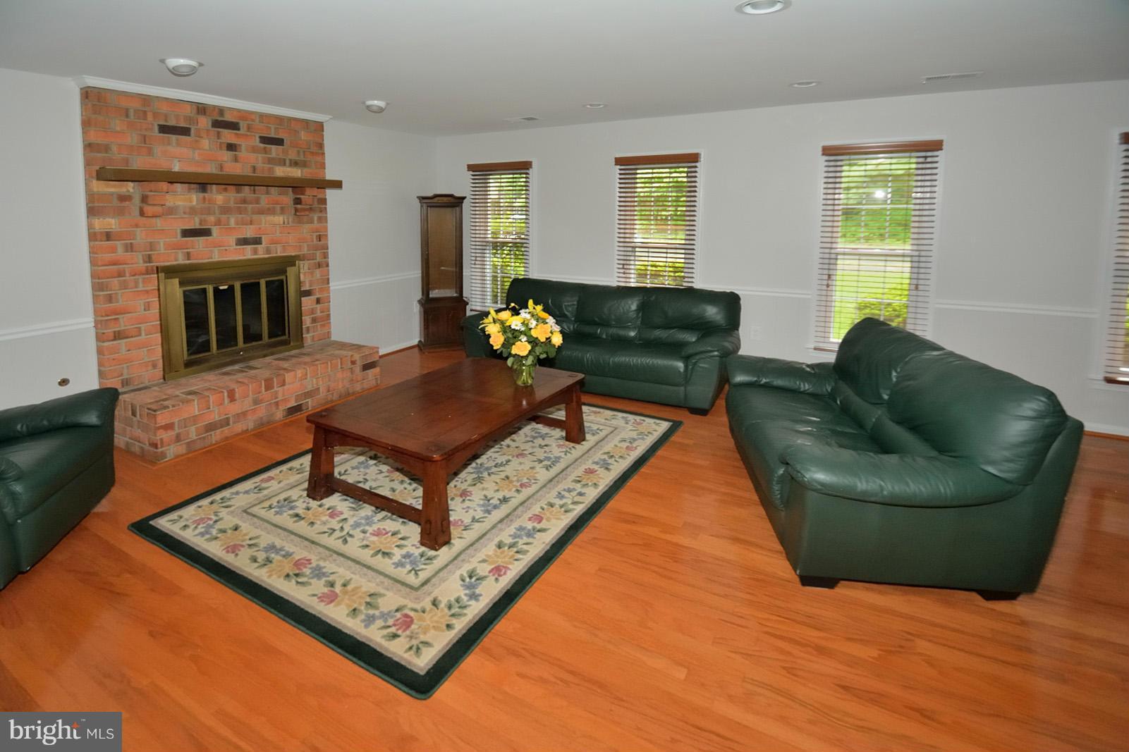 11626 Ayreshire Road Oakton, VA 22124 - Photo 20 of 26 Lots of Windows. Brick FP with Gas Logs.