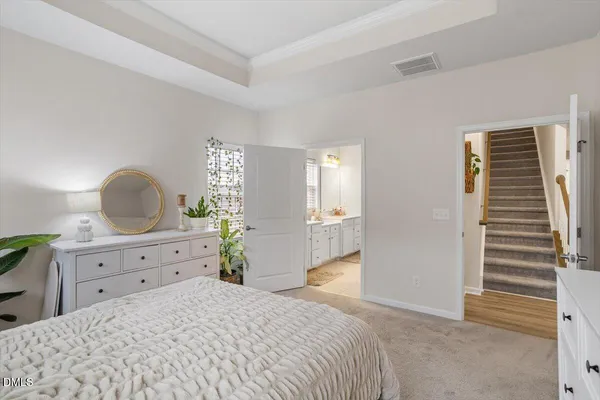 a bedroom with a bed and a dresser