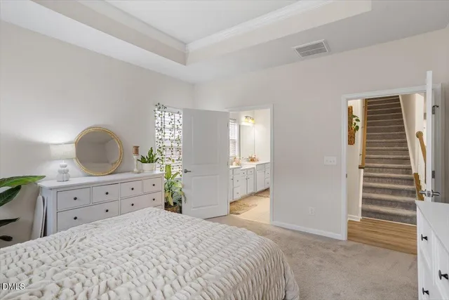 a bedroom with a bed and a dresser