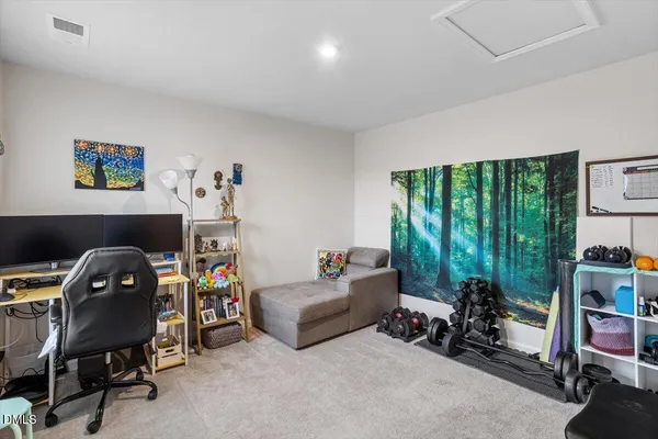 a view of living room with furniture and a window