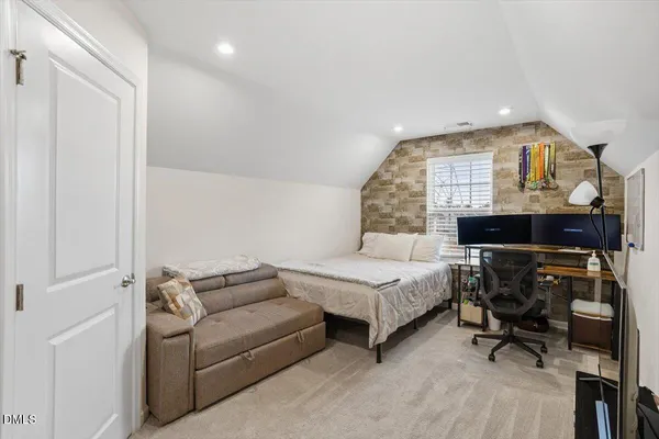 a bathroom with a sink a toilet and shower curtain