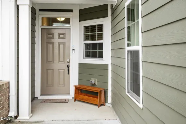 a front view of a house with a large window