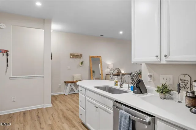 a kitchen with a sink and cabinets