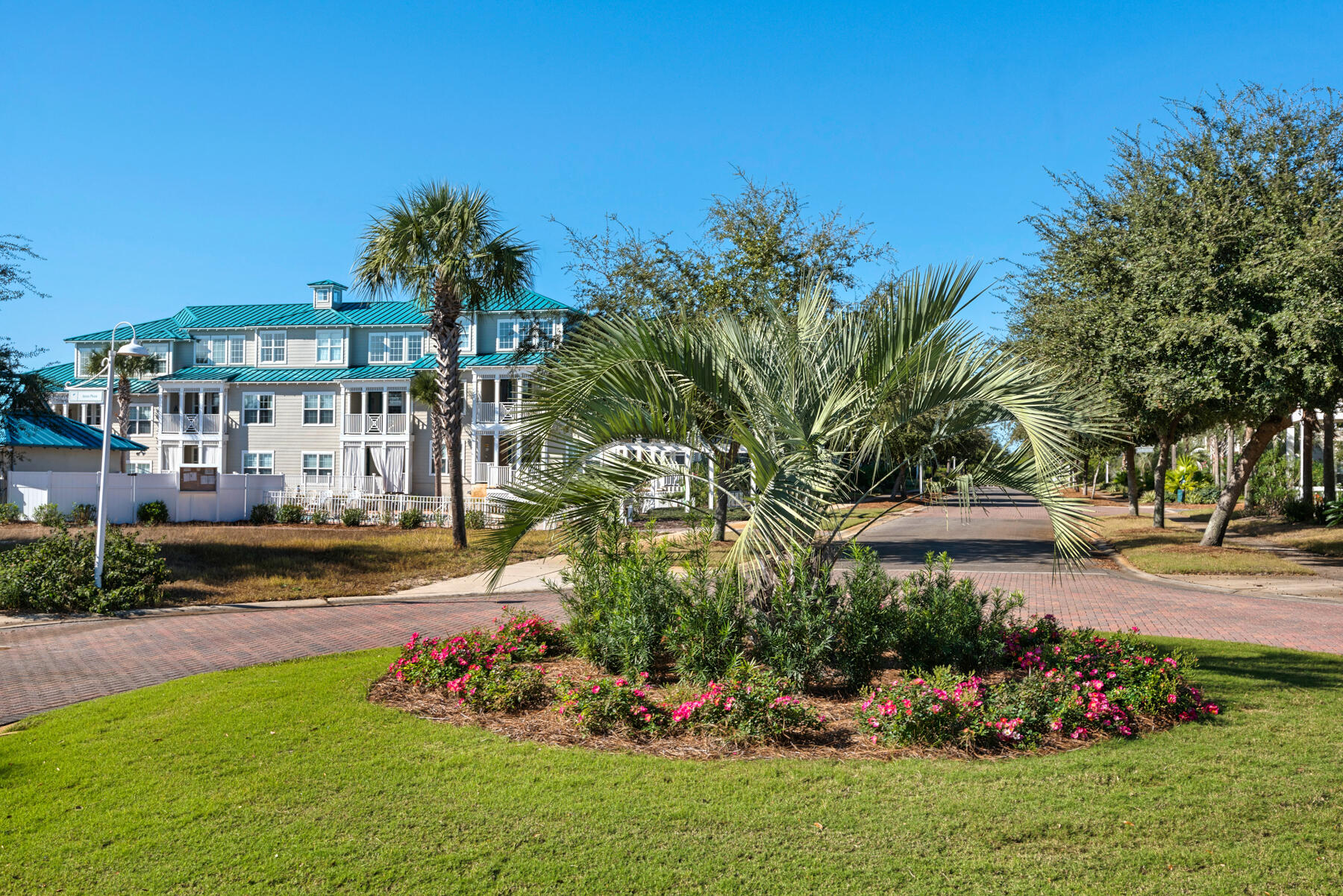 104 Village Boulevard, Unit 625 Santa Rosa Beach, FL 32459 - Photo 27 of 38 a view of a garden with a building in the background
