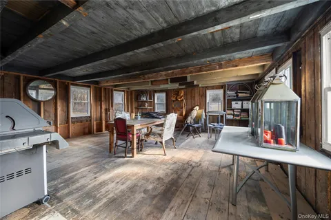 a living room with lots of furniture and a wooden floor