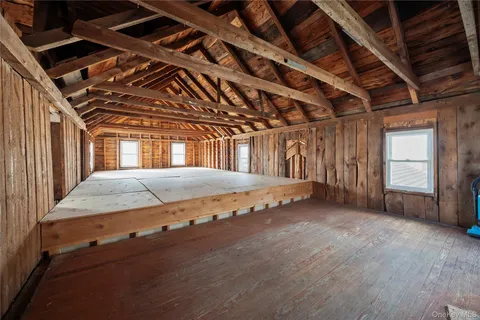 a view of a room with wooden walls