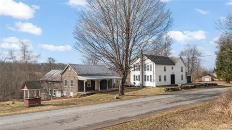 a view of a city street lined with buildings and trees