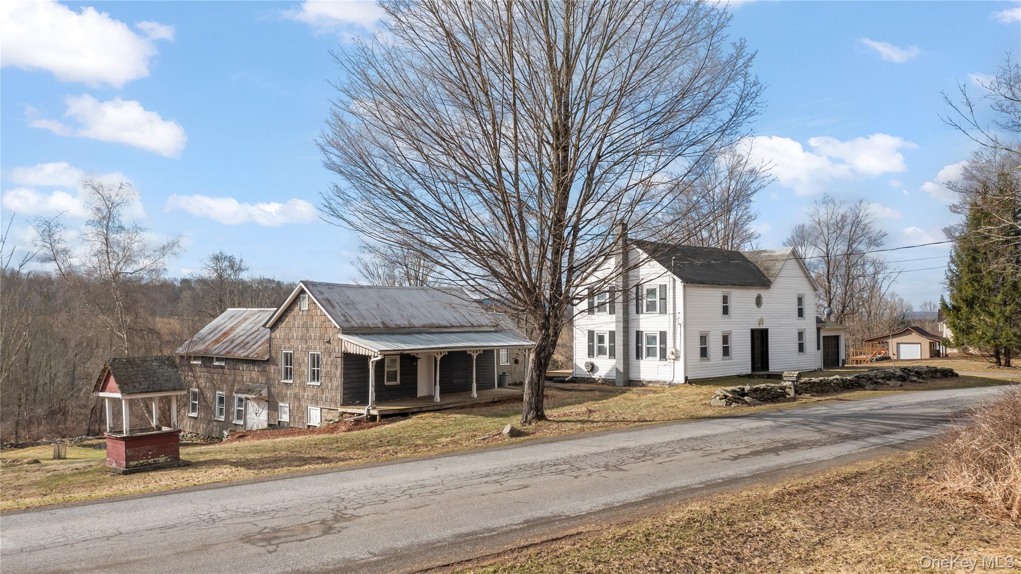 700 Mettacahonts Road Accord, NY 12404 - Photo 2 of 47 a view of a city street lined with buildings and trees