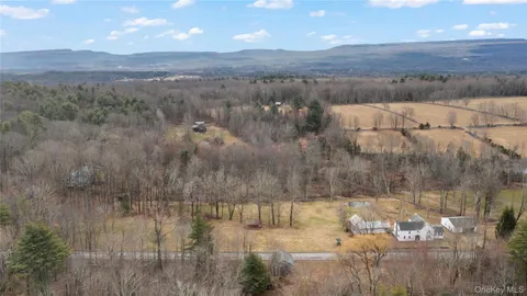 a view of barn with a small yard