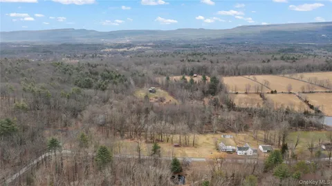 a view of a house with a yard and garage
