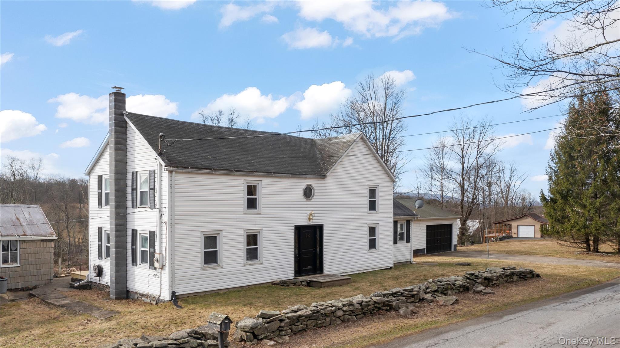 700 Mettacahonts Road Accord, NY 12404 - Photo 3 of 47 a front view of a house with a yard