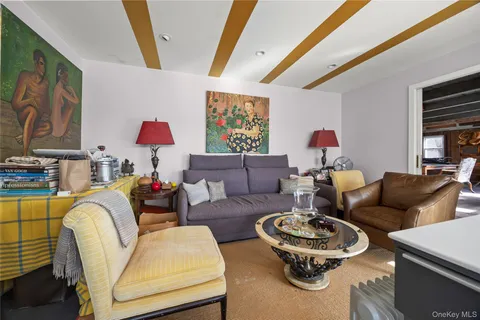 a living room with furniture and a rug