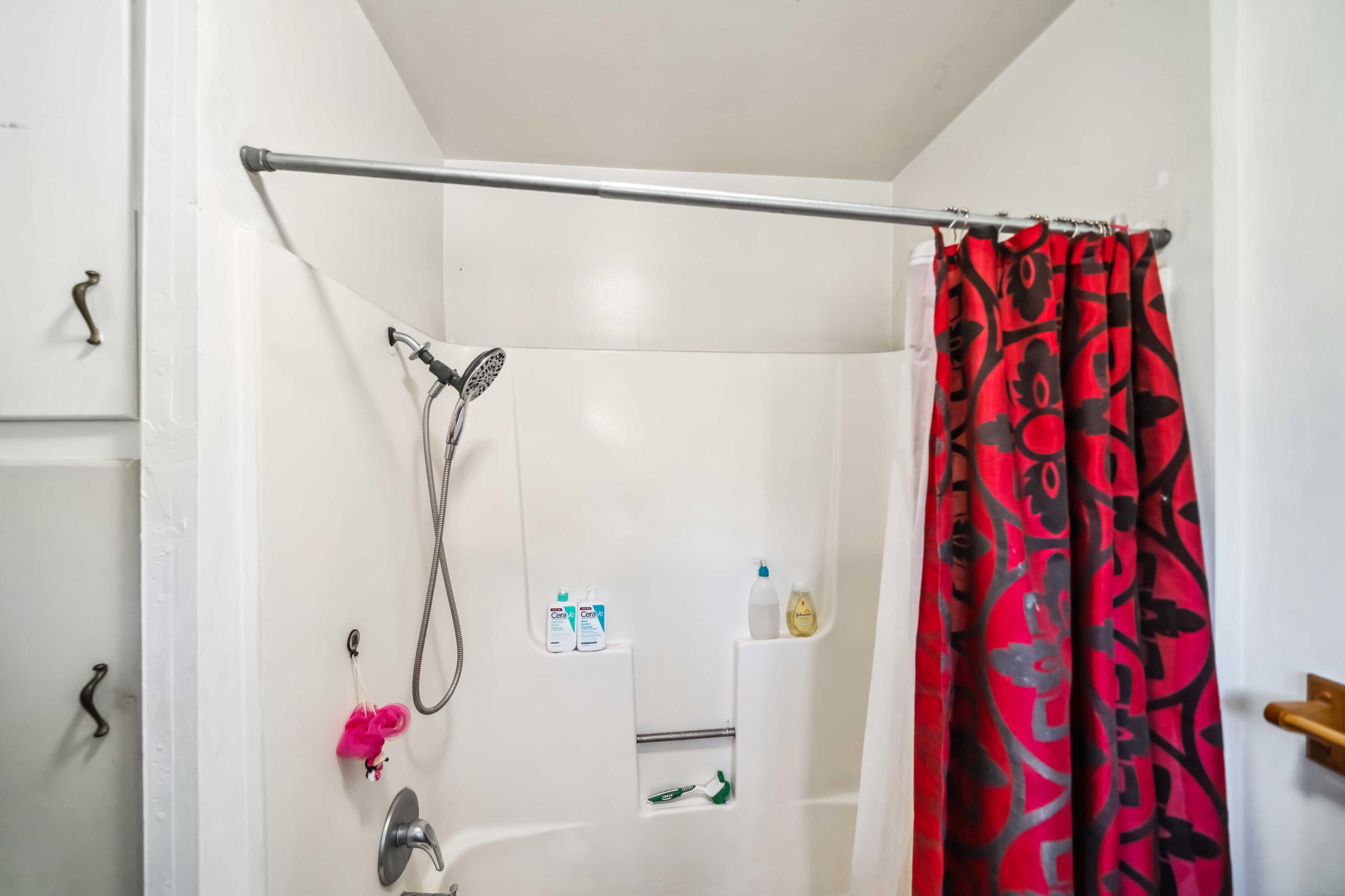 5450 Cedars Road Redding, CA 96001 - Photo 14 of 21 a bathroom with a shower and a shower curtain