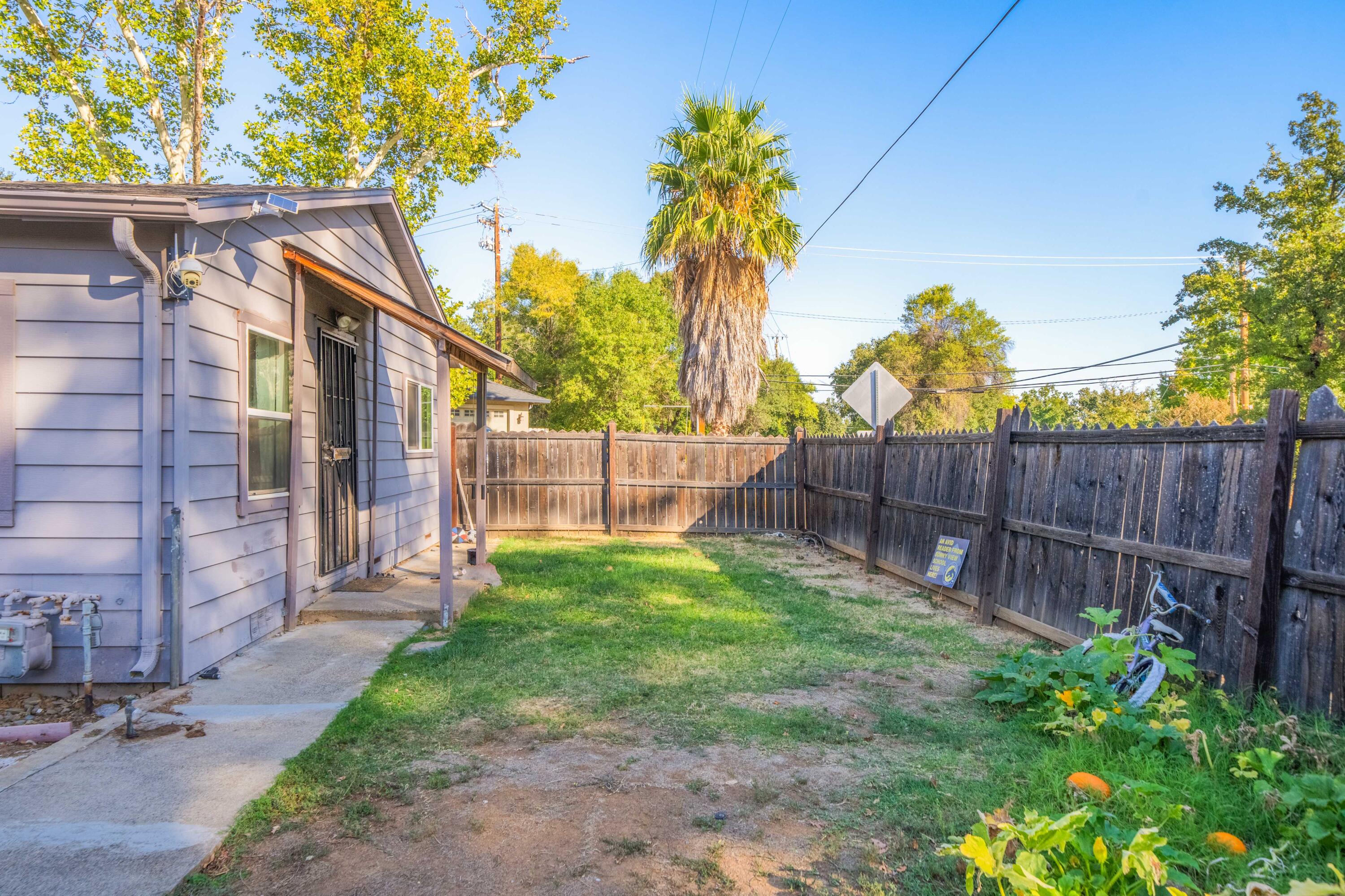 5450 Cedars Road Redding, CA 96001 - Photo 2 of 21 a view of a backyard with a garden