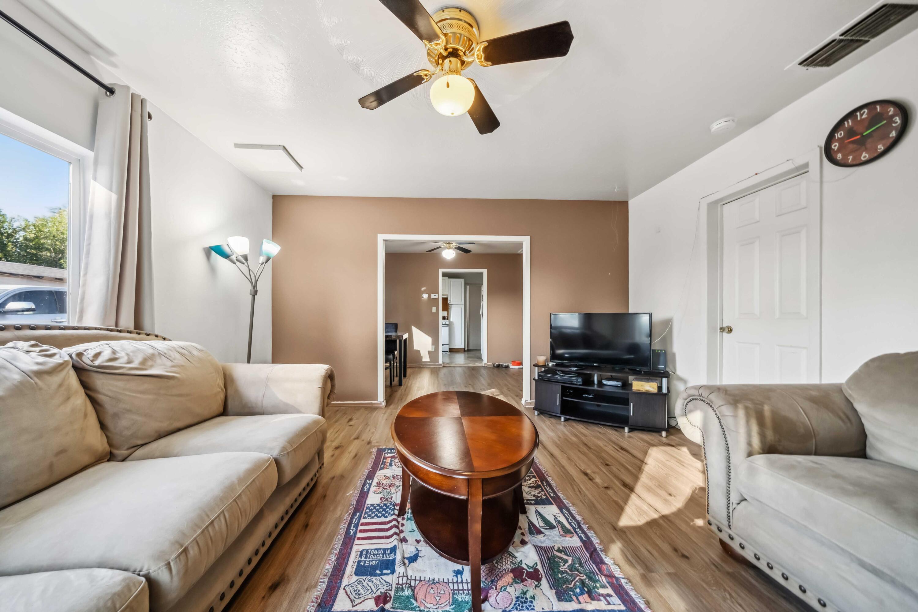 5450 Cedars Road Redding, CA 96001 - Photo 5 of 21 a living room with furniture a flat screen tv and a window
