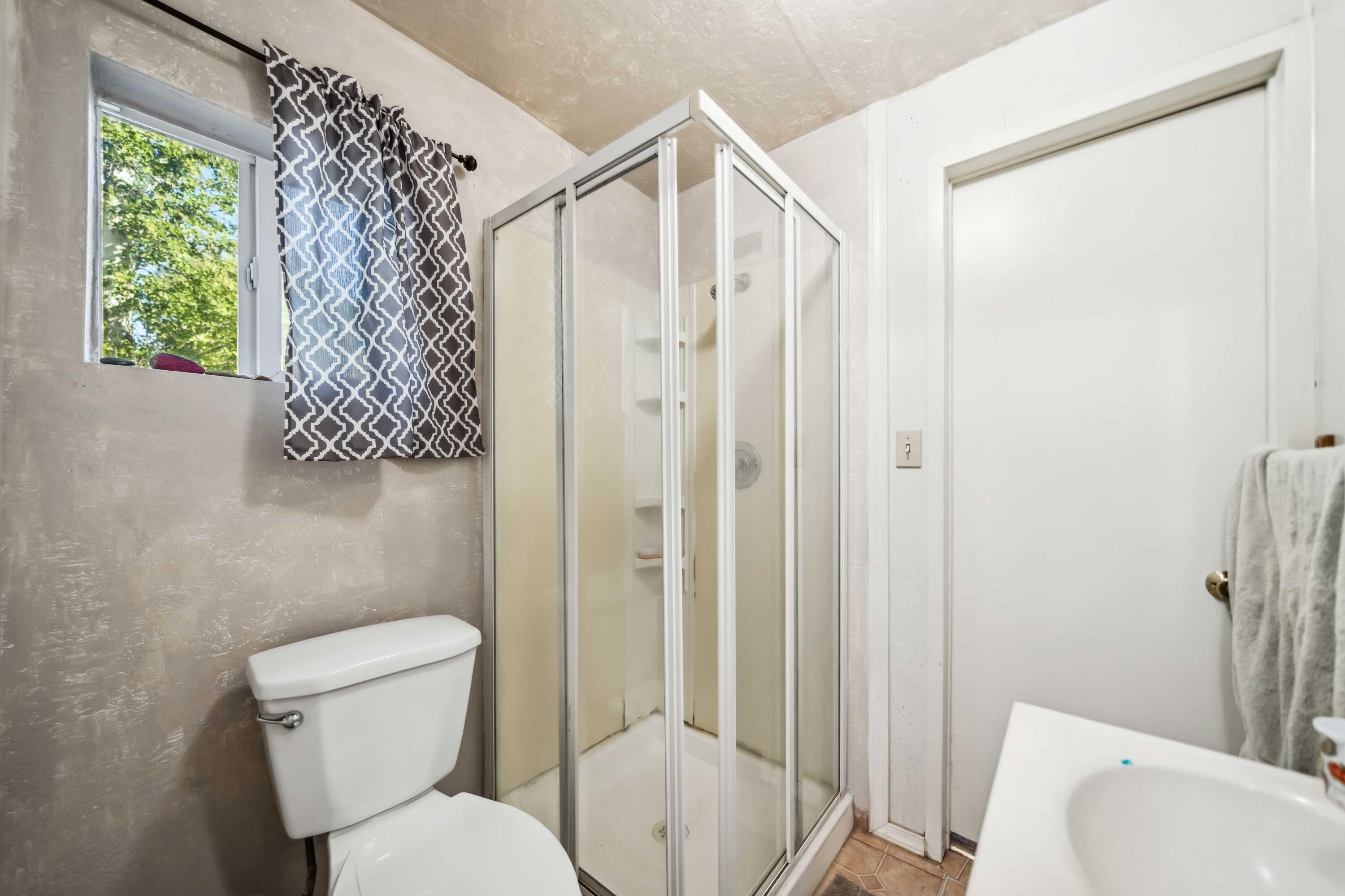5450 Cedars Road Redding, CA 96001 - Photo 10 of 21 a bathroom with a toilet and a shower