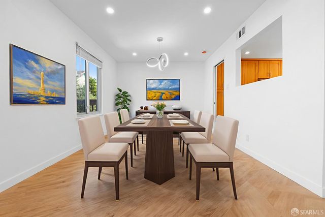 a kitchen with a refrigerator and a sink