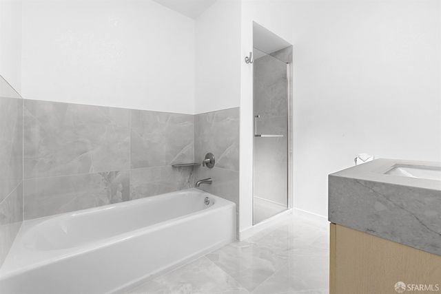 a spacious bedroom with a large bed and furniture