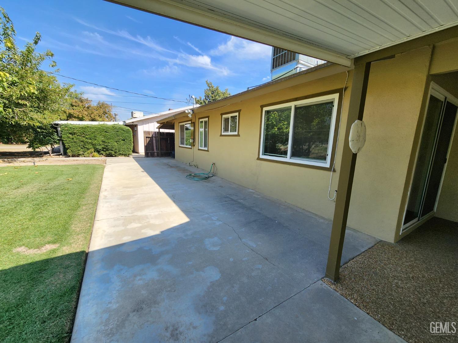 Undisclosed Address Bakersfield, CA 93309 - Photo 19 of 22 a front view of a house with a yard