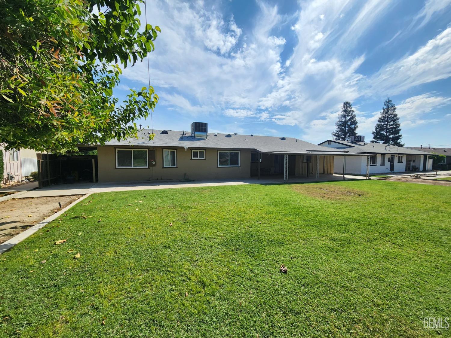 Undisclosed Address Bakersfield, CA 93309 - Photo 22 of 22 a view of a house with a swimming pool