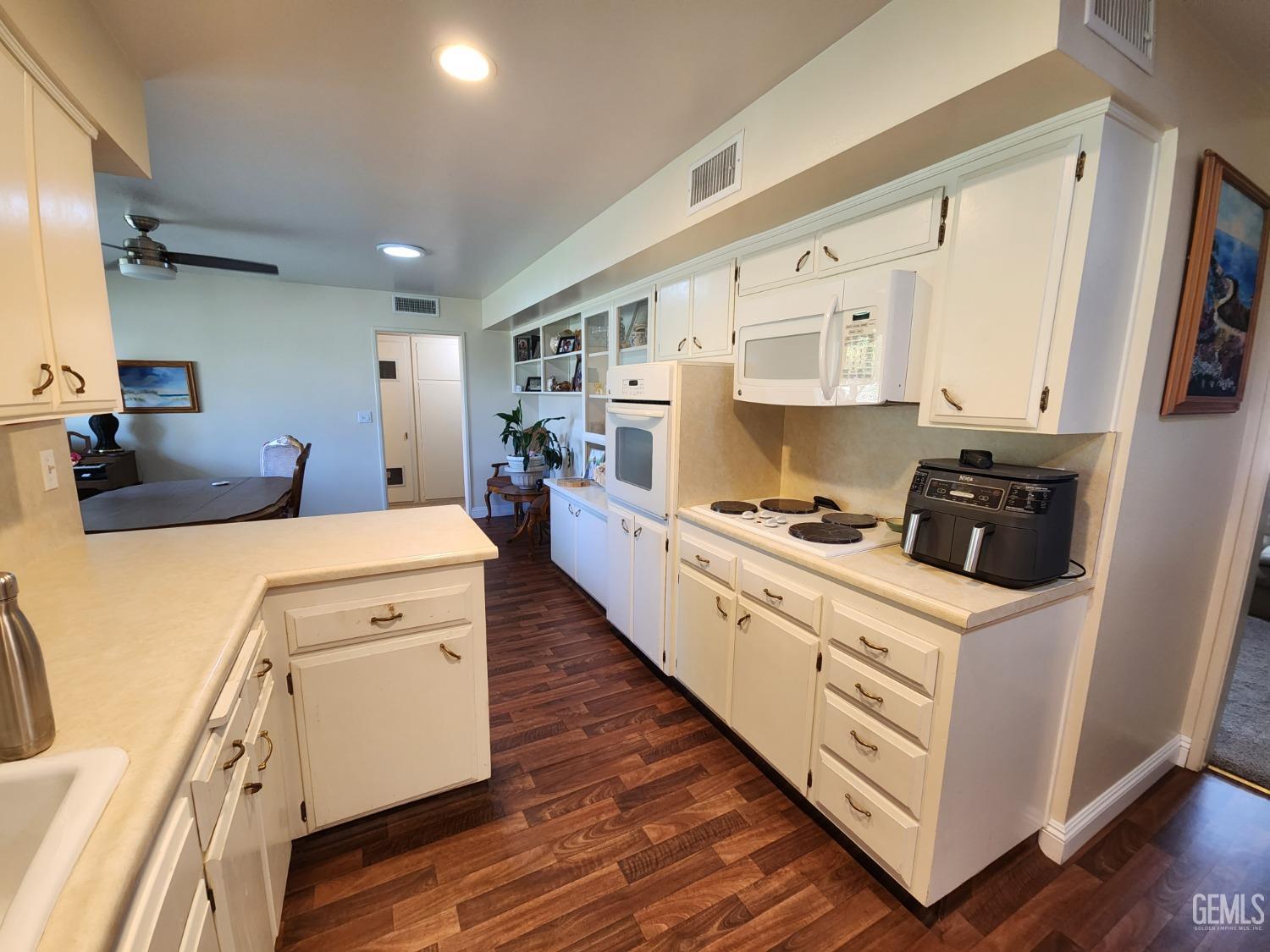 Undisclosed Address Bakersfield, CA 93309 - Photo 6 of 22 a large white room with cabinets