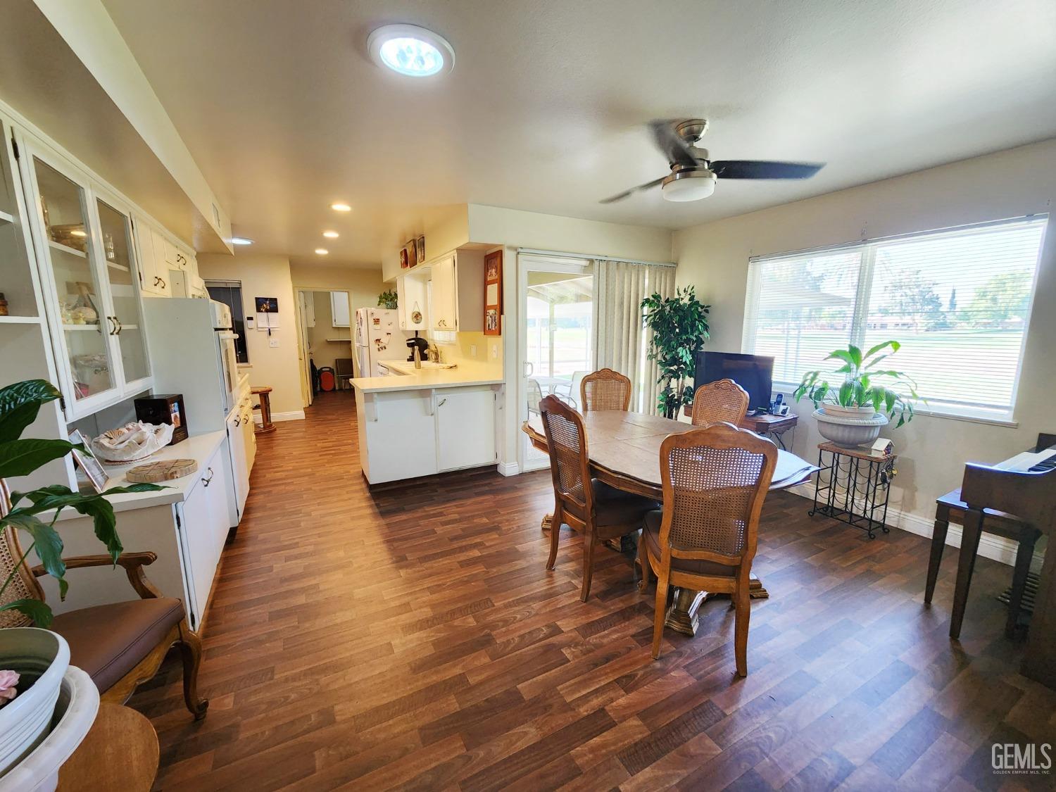 Undisclosed Address Bakersfield, CA 93309 - Photo 7 of 22 a view of a dining room with furniture window and wooden floor