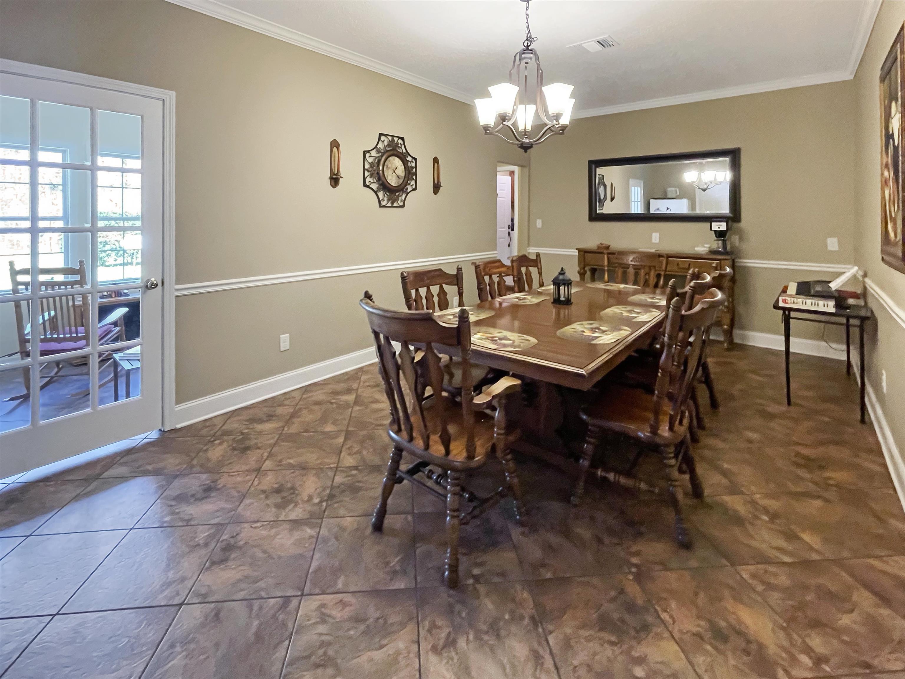 201 Cannon Road Ripley, TN 38063 - Photo 7 of 20 a view of a dining room with furniture and chandelier