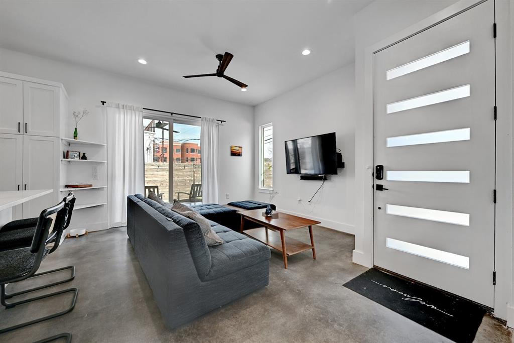 2812 East 4th Street, Unit 2 Austin, TX 78702 - Photo 6 of 26 Living area featuring polished concrete flooring, a modern ceiling fan, and recessed lighting