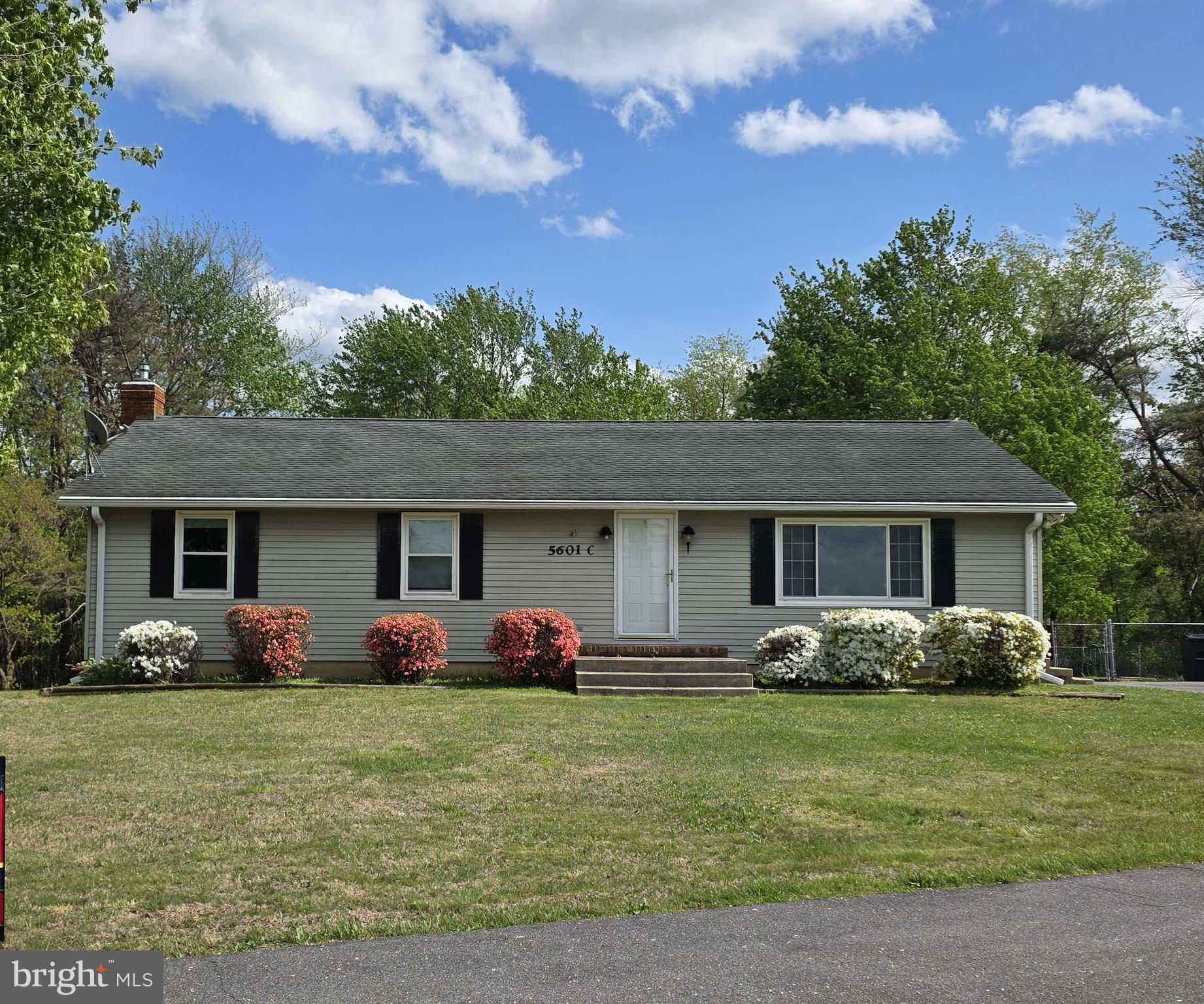 5601 Woodville Road Mount Airy, MD 21771 - Photo 3 of 54 a front view of house with yard and green space