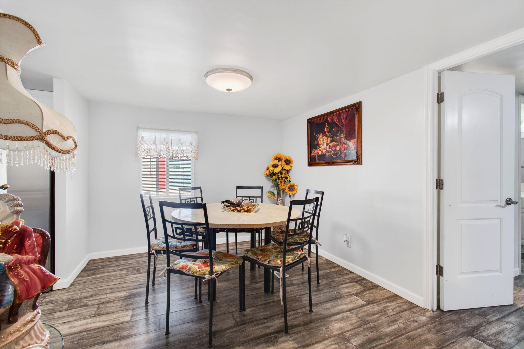 22849 Tradewind Road Boca Raton, FL 33428 - Photo 19 of 60 a view of a dining room with furniture and wooden floor