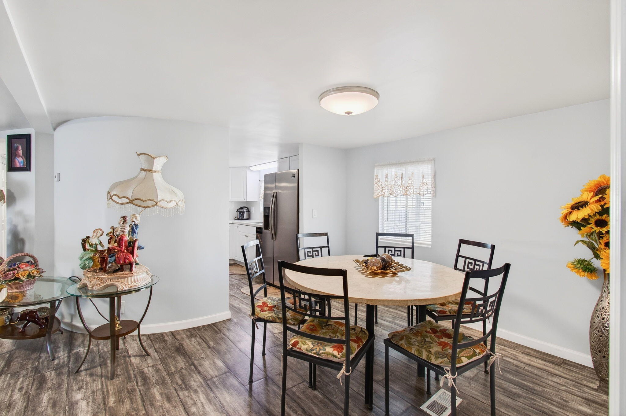 22849 Tradewind Road Boca Raton, FL 33428 - Photo 20 of 60 a view of a dining room with furniture and wooden floor