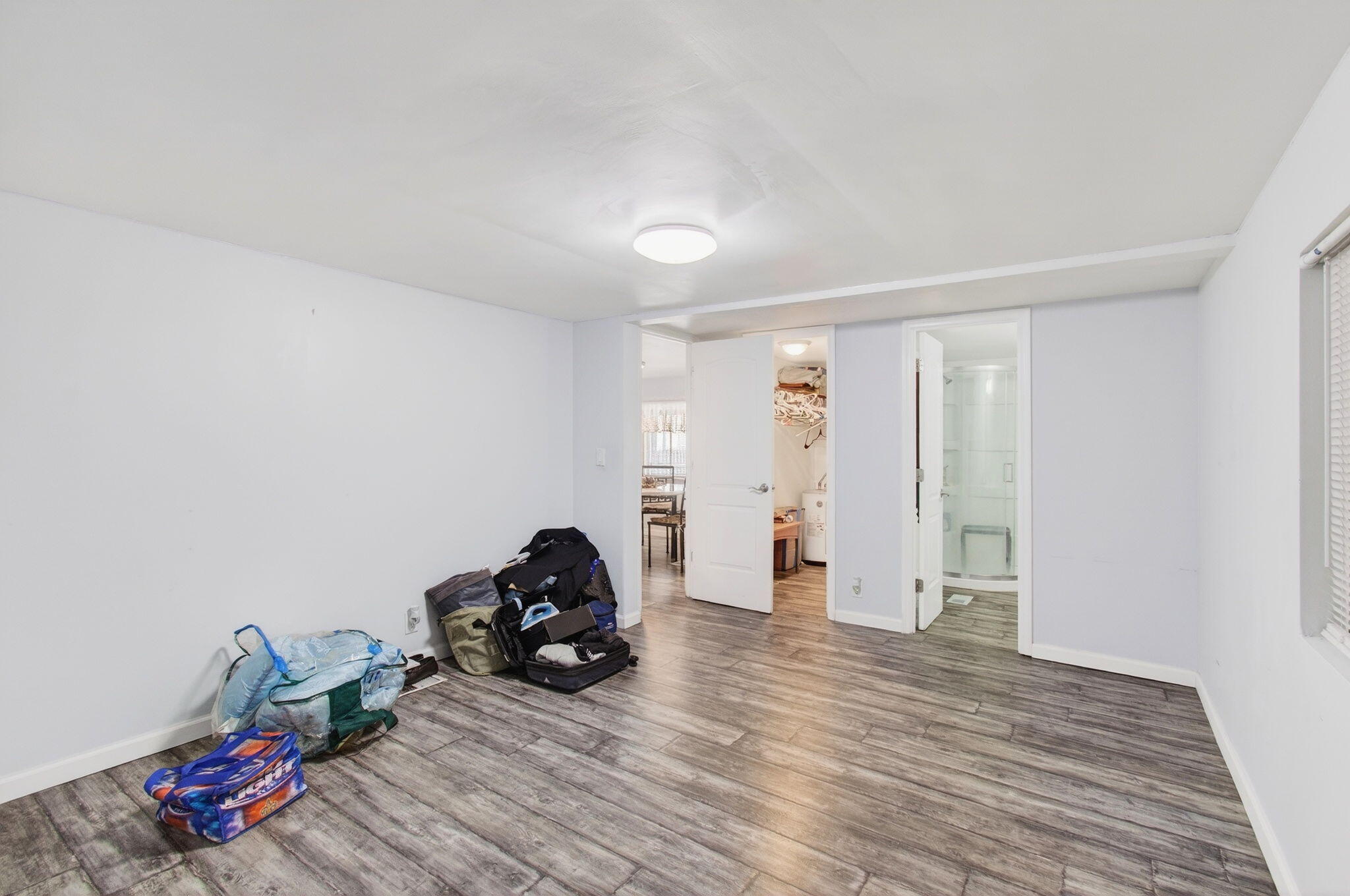 22849 Tradewind Road Boca Raton, FL 33428 - Photo 27 of 60 a view of a room with wooden floor and gym equipment