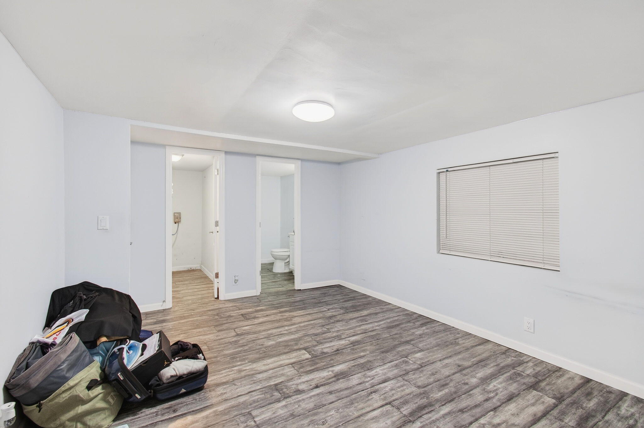 22849 Tradewind Road Boca Raton, FL 33428 - Photo 28 of 60 a view of a room with wooden floor and bathroom