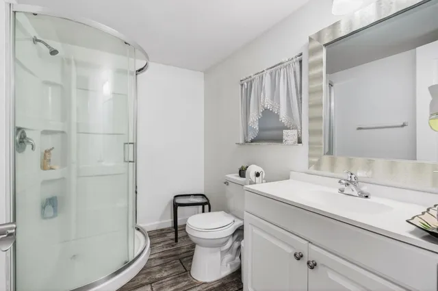 a bathroom with a toilet a sink and bathtub