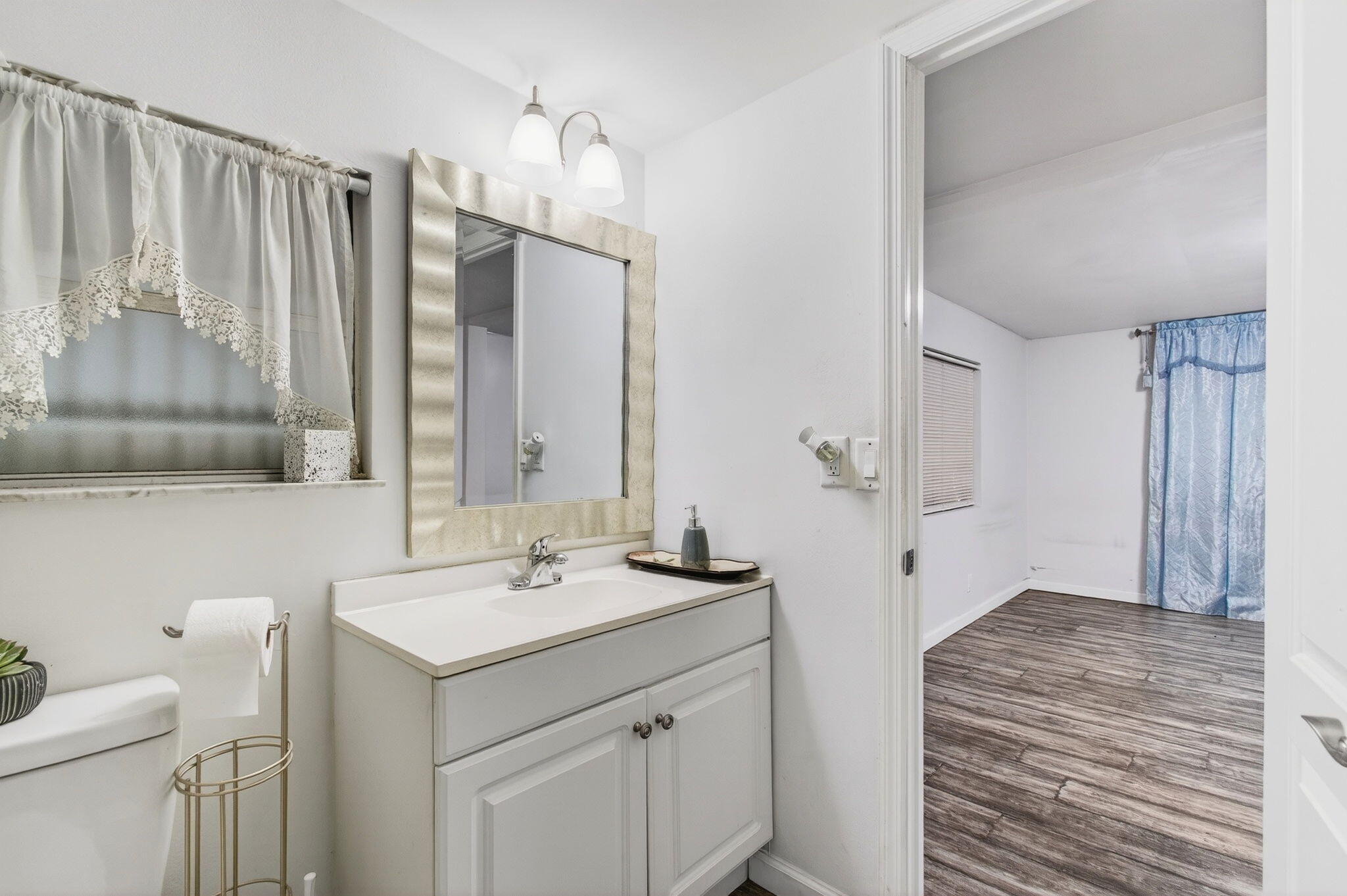 22849 Tradewind Road Boca Raton, FL 33428 - Photo 33 of 60 a bathroom with a sink a toilet and shower
