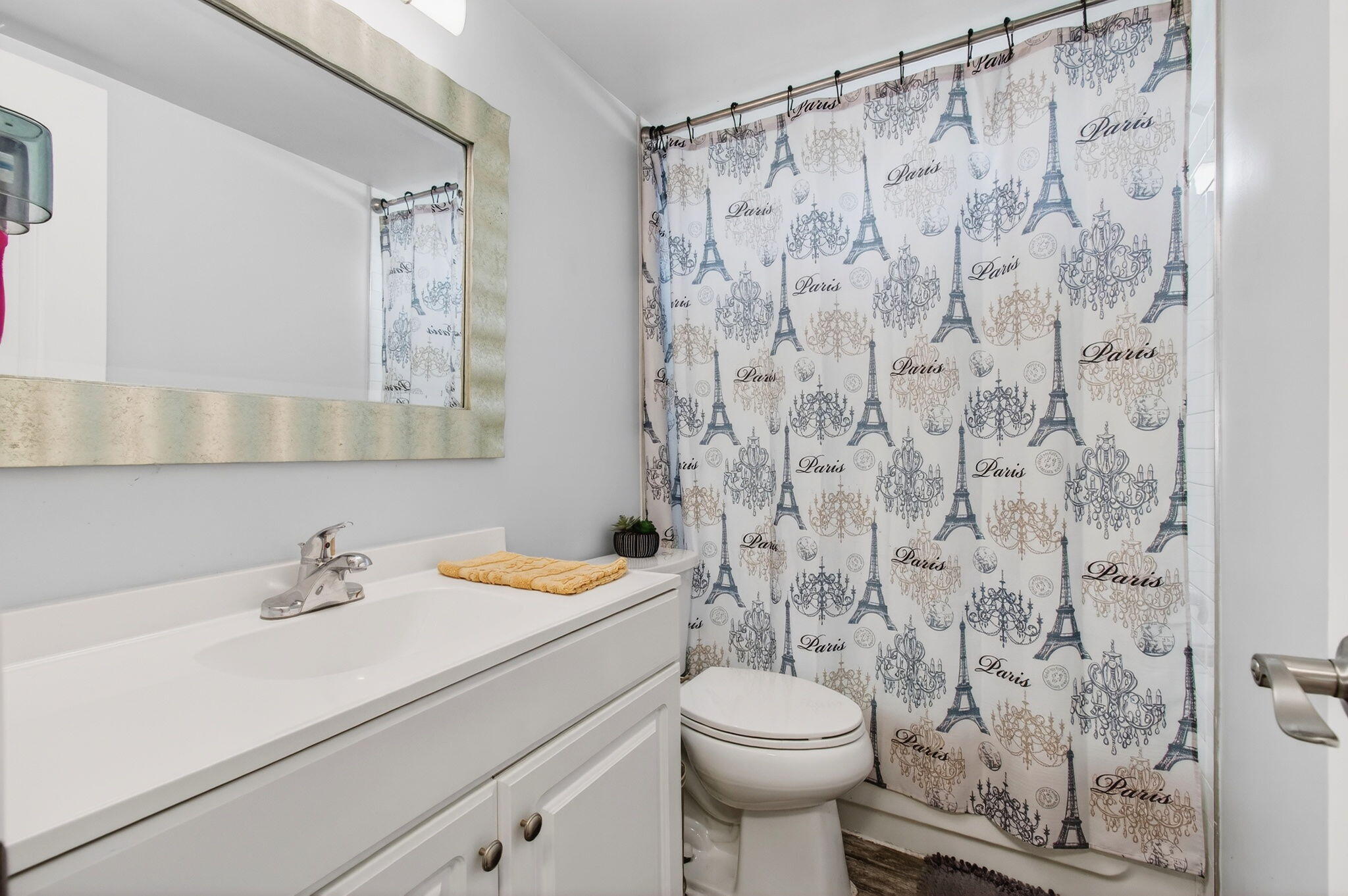 22849 Tradewind Road Boca Raton, FL 33428 - Photo 34 of 60 a bathroom with a sink a toilet and shower curtain