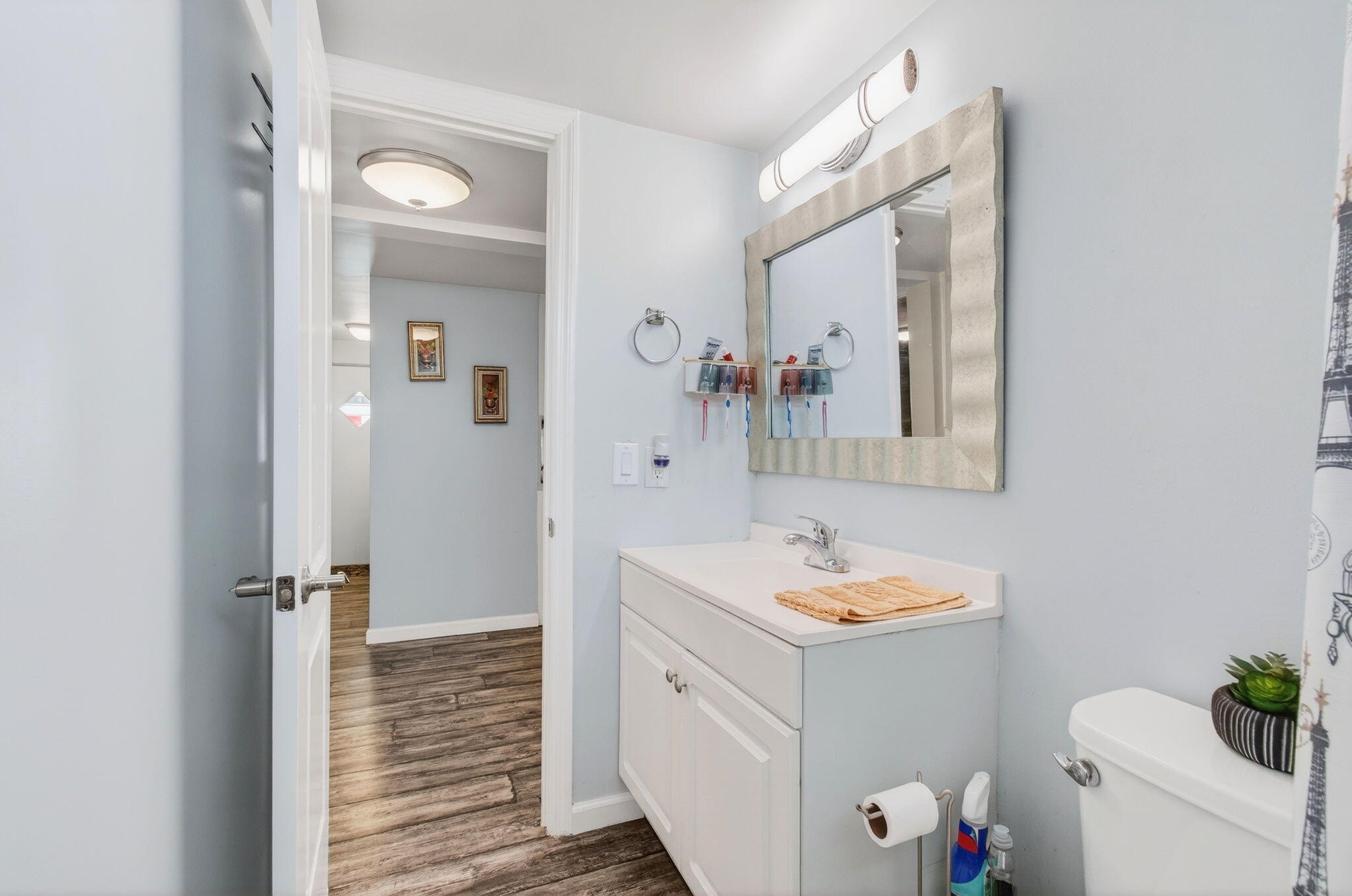 22849 Tradewind Road Boca Raton, FL 33428 - Photo 36 of 60 a bathroom with a granite countertop sink and a mirror