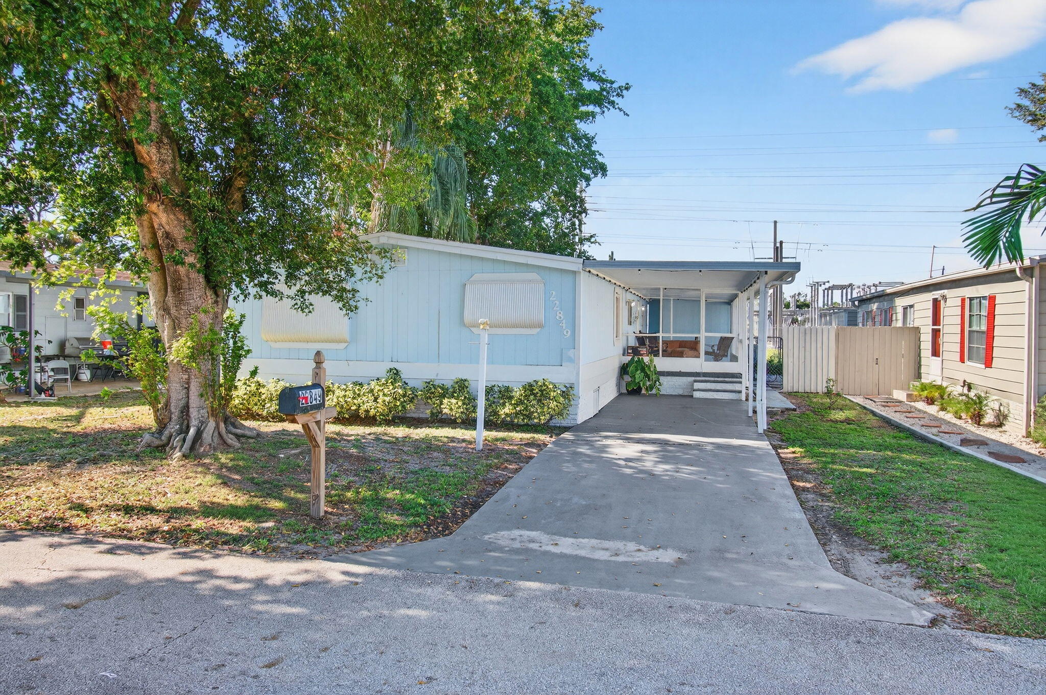 22849 Tradewind Road Boca Raton, FL 33428 - Photo 4 of 60 a view of a back yard of the house