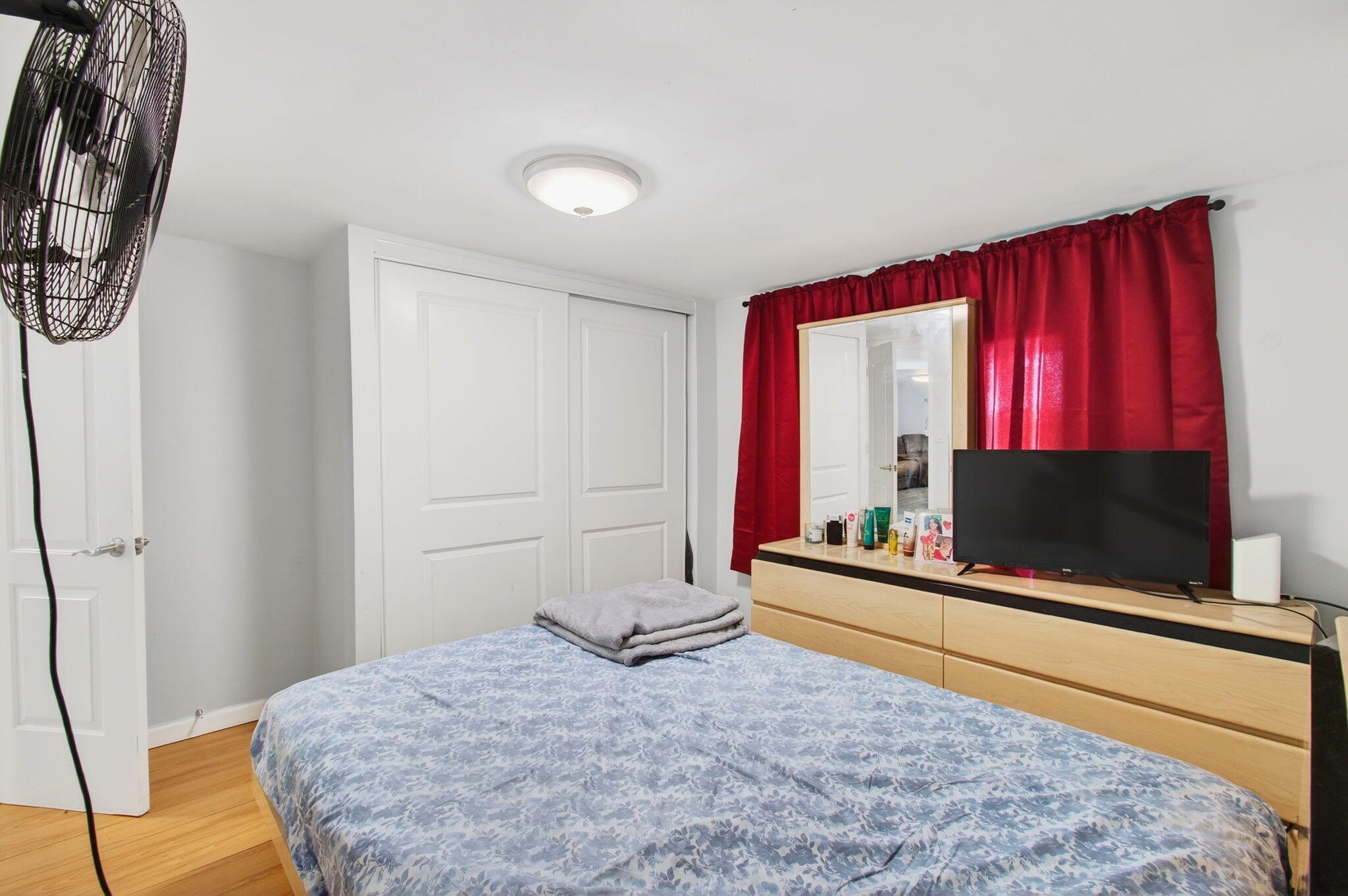 22849 Tradewind Road Boca Raton, FL 33428 - Photo 42 of 60 a bedroom with a bed and a flat screen tv