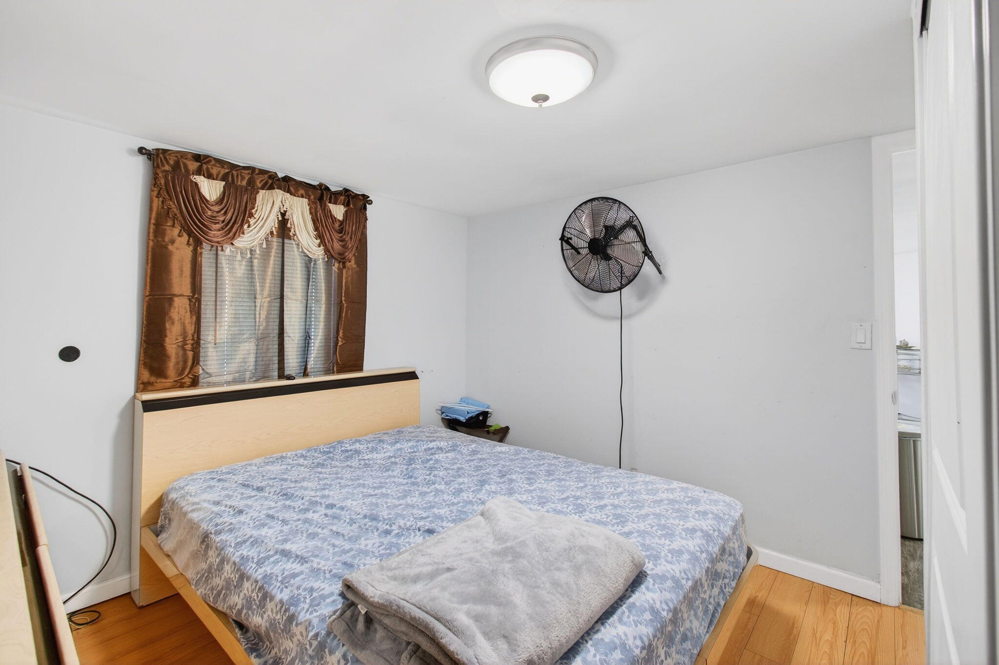 22849 Tradewind Road Boca Raton, FL 33428 - Photo 43 of 60 a bedroom with a bed and a window