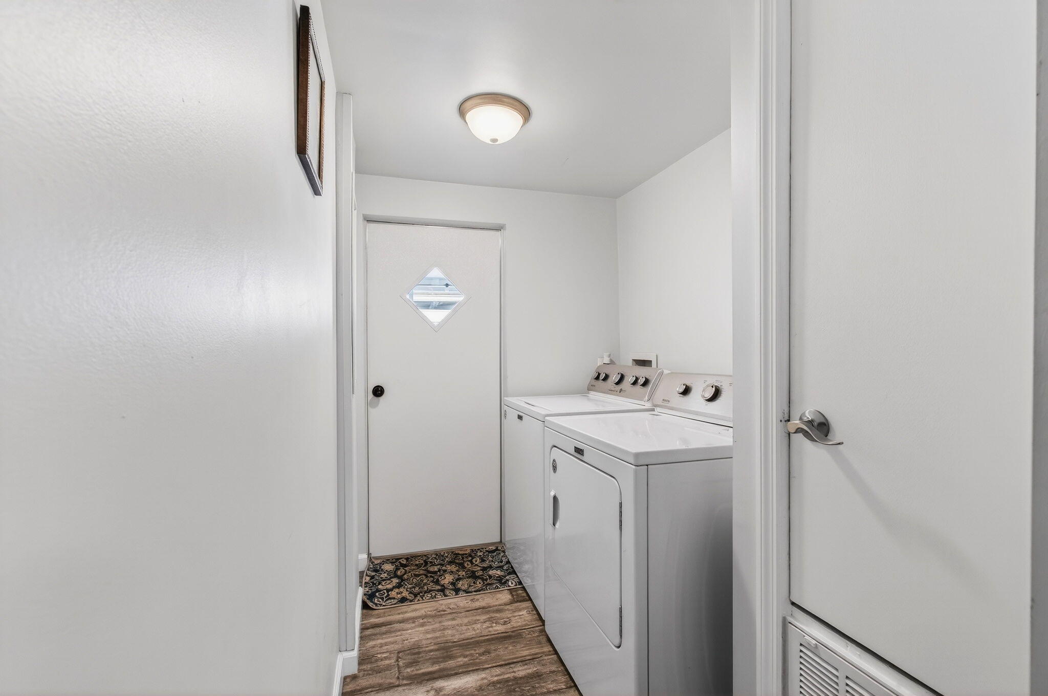 22849 Tradewind Road Boca Raton, FL 33428 - Photo 44 of 60 a utility room with cabinets washer and dryer