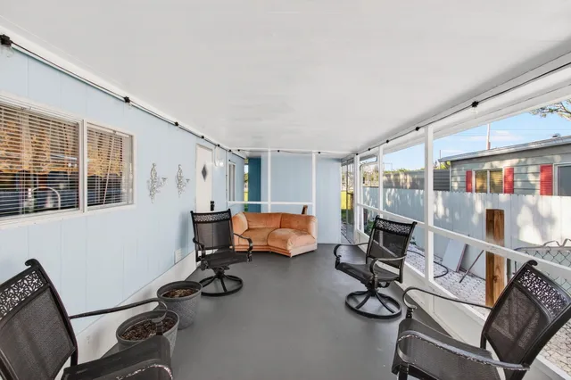 a view of a backyard with a tree